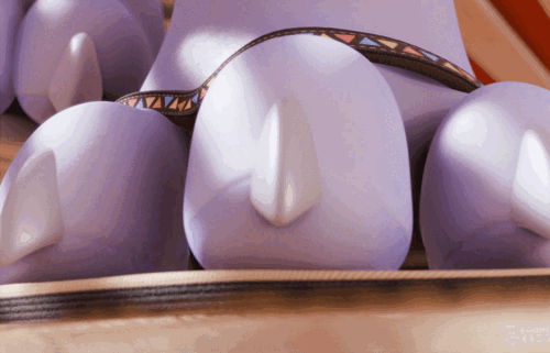 A close up view of dragon paws in a sandal sitting indoors; the toes lifting up and thumping down.