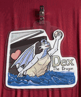 A dragon as a ship's figurehead, holding a globe.