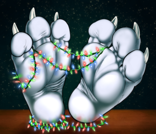 A dragon's paws with holiday lights draped between them.