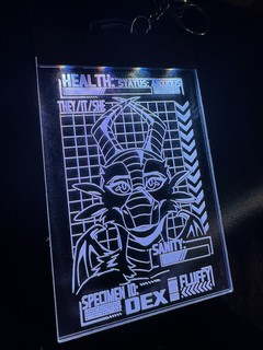 A badge featuring an anxious dragon, illuminated by white LEDs.